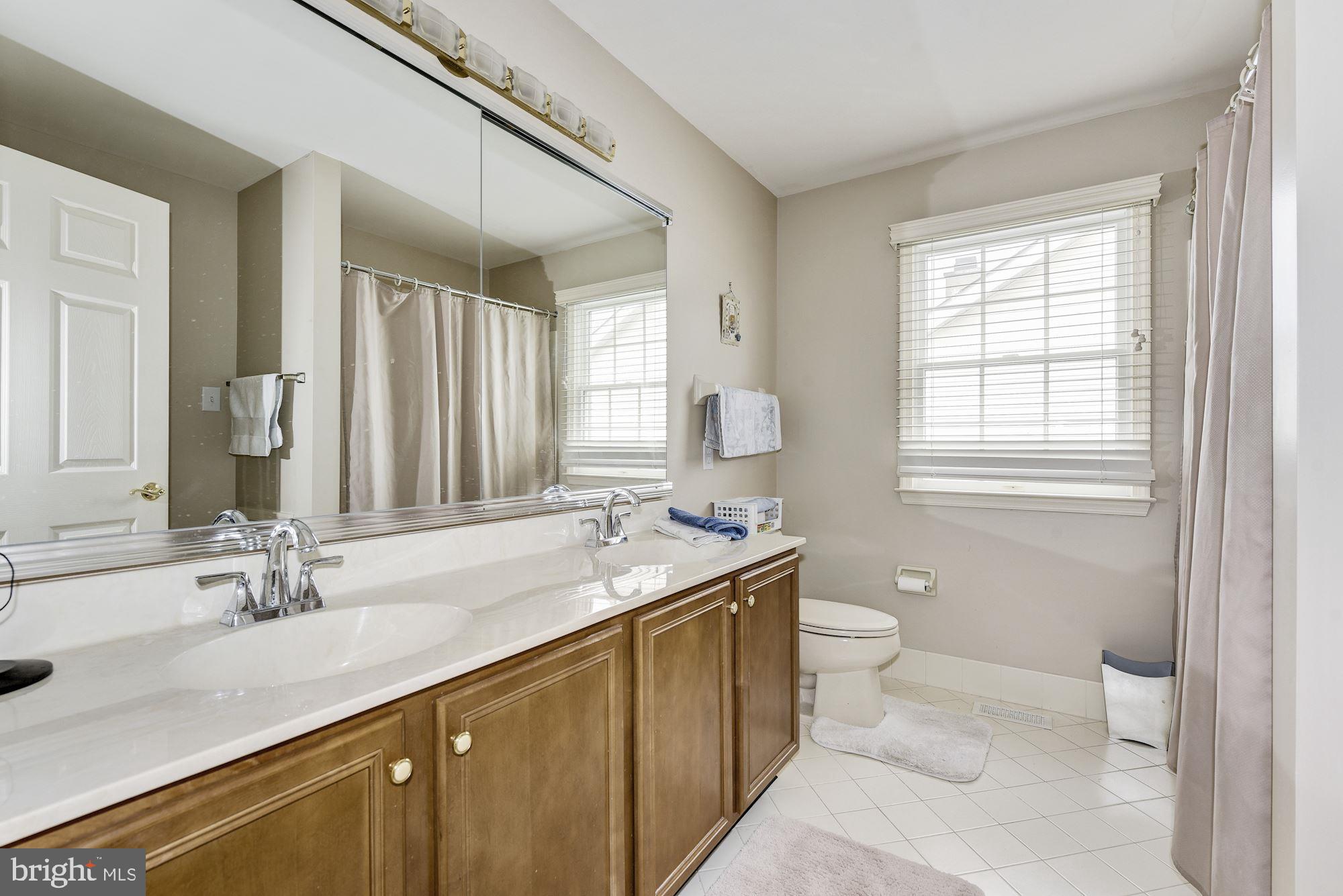 126 Augusta Drive Moorestown, NJ 08057 - Photo 25 of 33 a bathroom with a sink double vanity granite and a toilet
