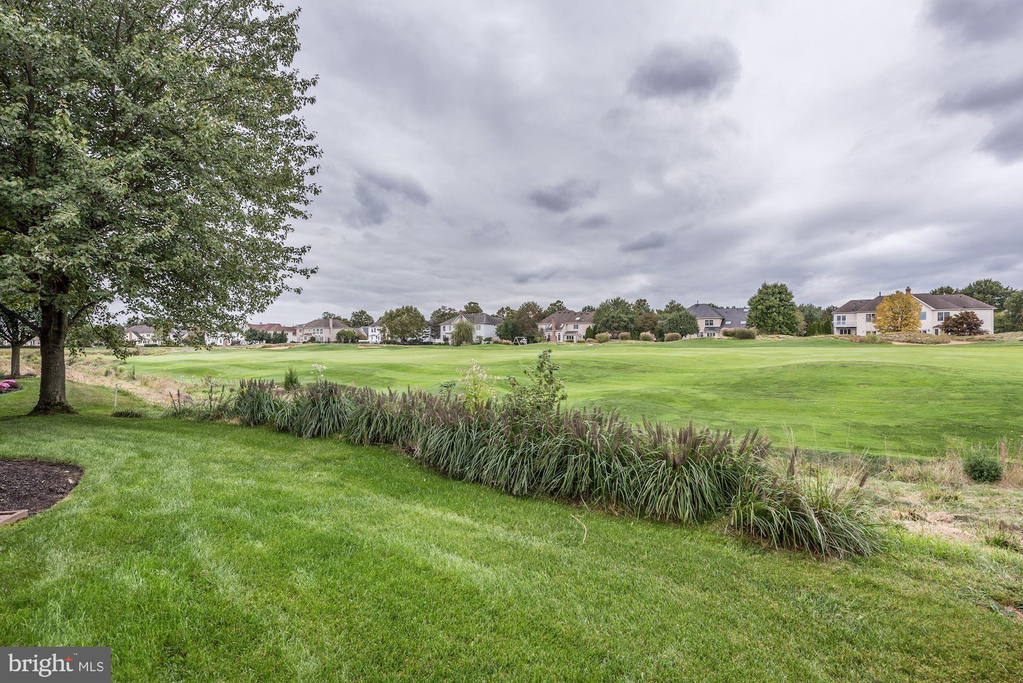 126 Augusta Drive Moorestown, NJ 08057 - Photo 28 of 33 a view of a green field with plants and trees in the background