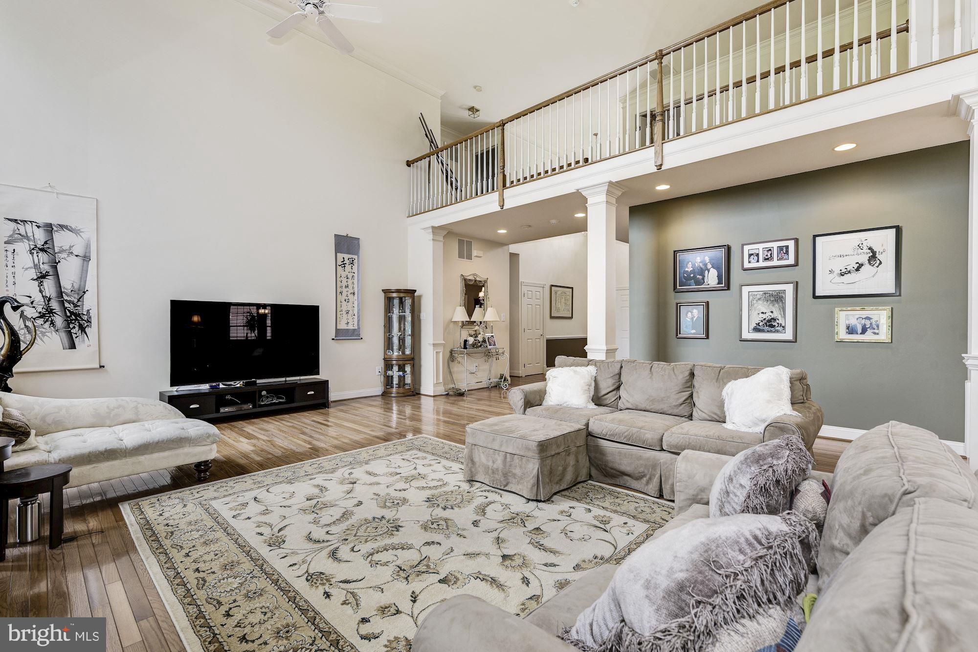 126 Augusta Drive Moorestown, NJ 08057 - Photo 4 of 33 a living room with furniture and a flat screen tv