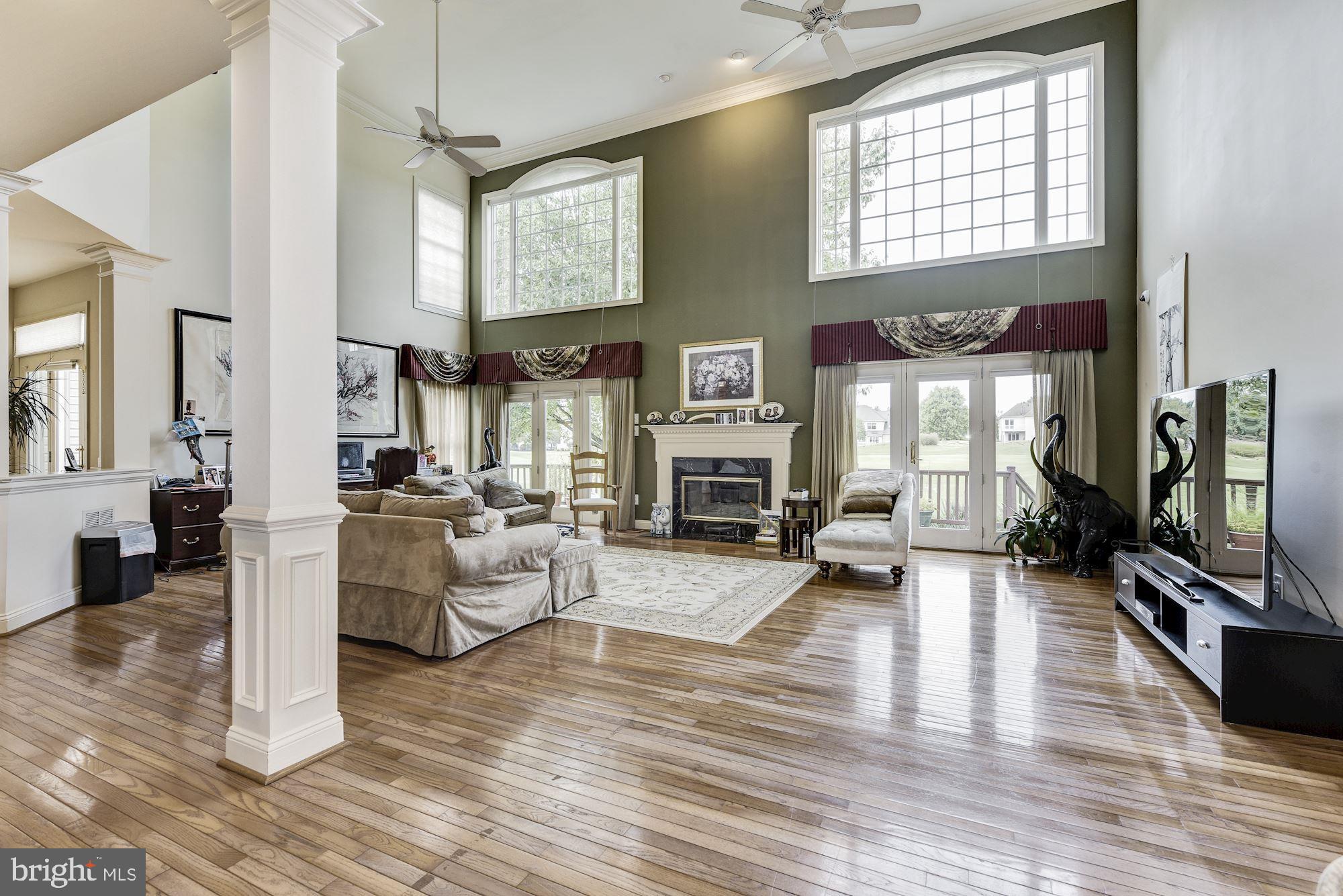 126 Augusta Drive Moorestown, NJ 08057 - Photo 5 of 33 a living room with furniture flat screen tv and a fireplace