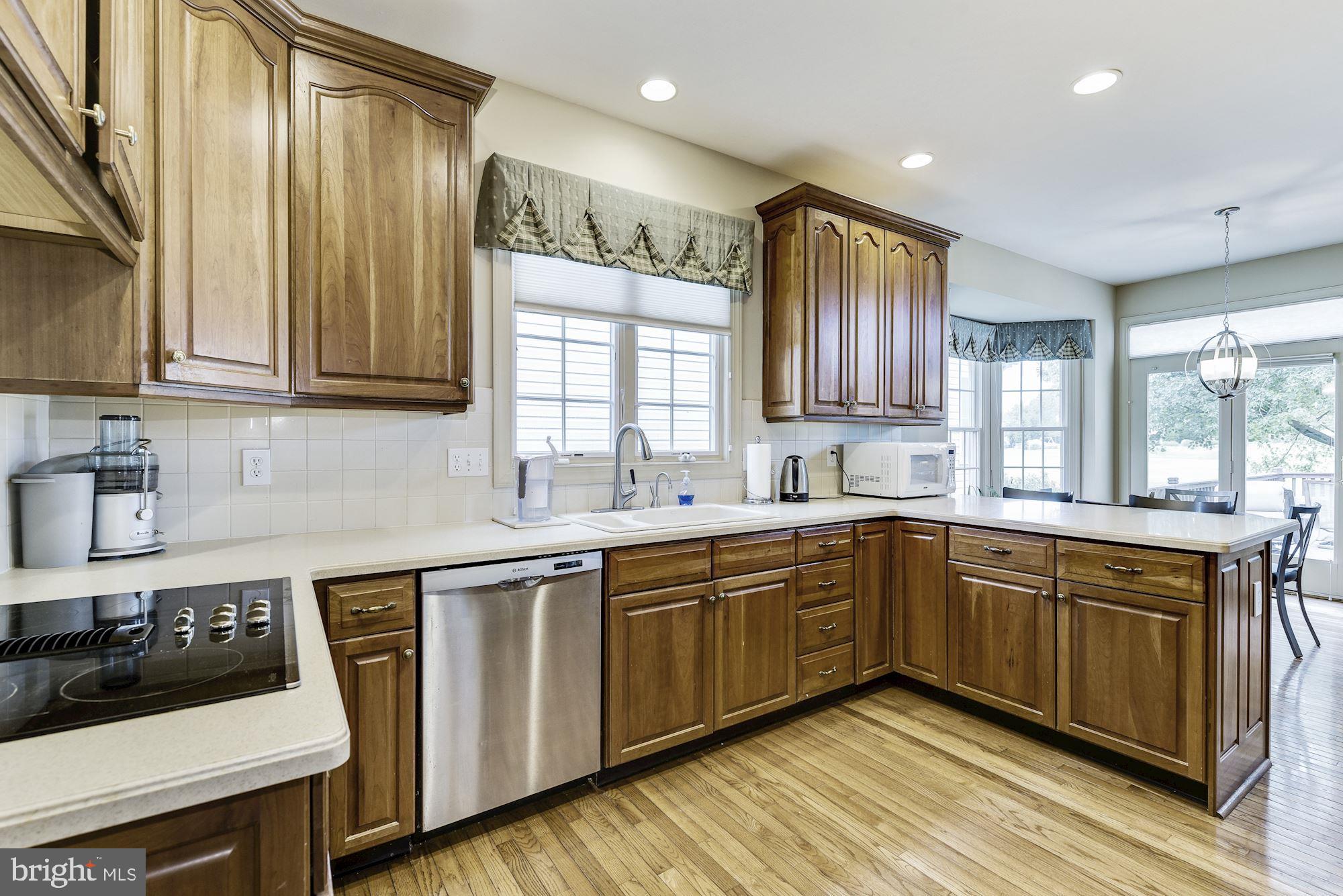 126 Augusta Drive Moorestown, NJ 08057 - Photo 10 of 33 a kitchen with a sink cabinets and window