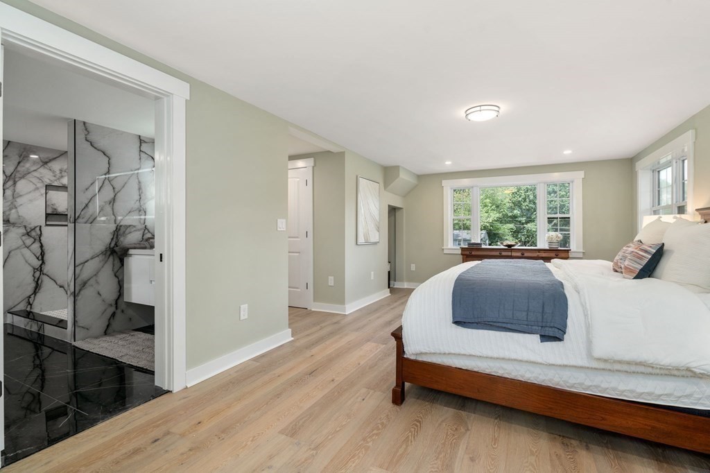 35 Longmeadow Road Medfield, MA 02052 - Photo 18 of 41 a spacious bedroom with a bed and a window