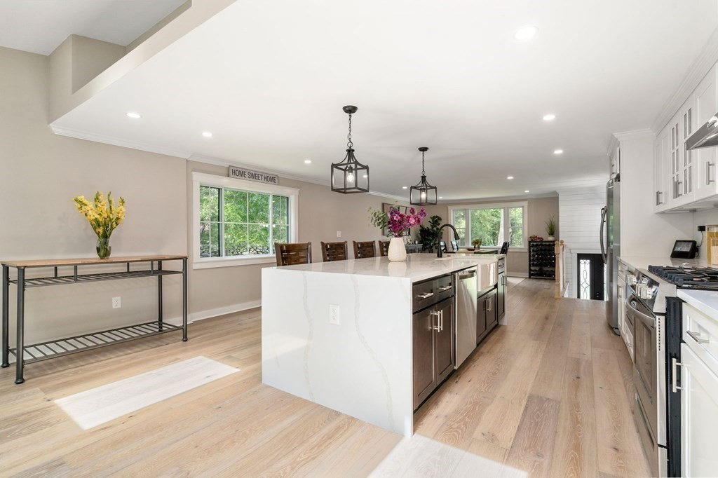 35 Longmeadow Road Medfield, MA 02052 - Photo 3 of 41 a kitchen with a stove a refrigerator and a counter top space