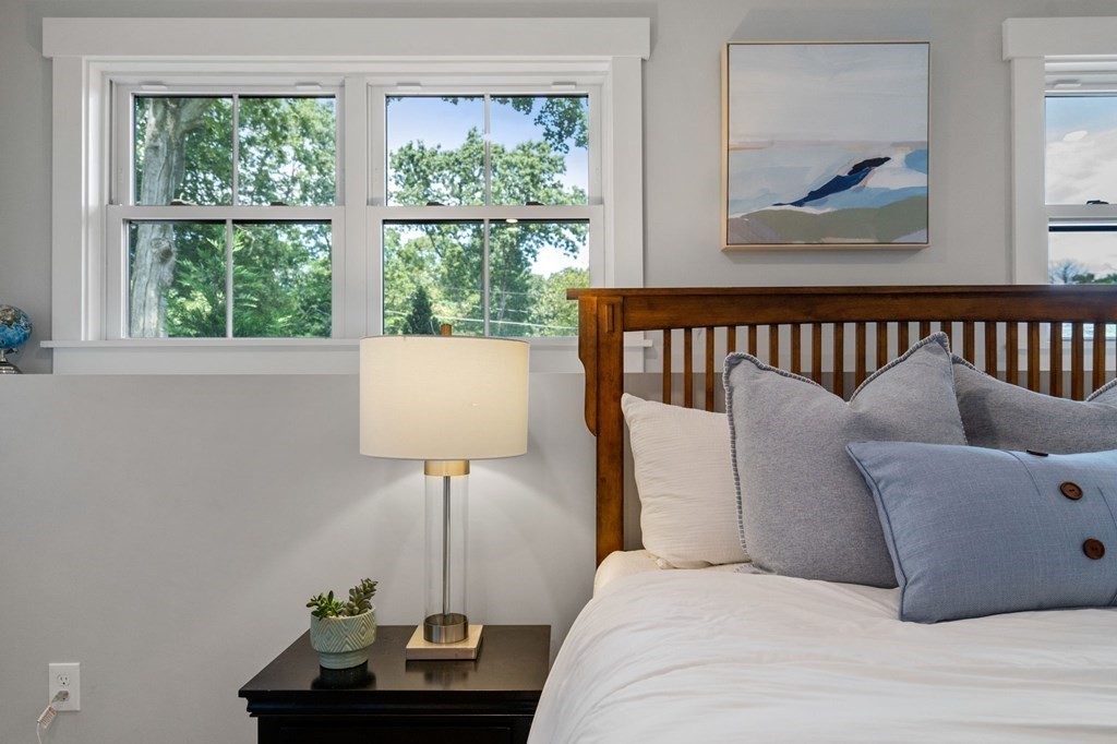 35 Longmeadow Road Medfield, MA 02052 - Photo 31 of 41 a bedroom with a bed and a painting on the wall