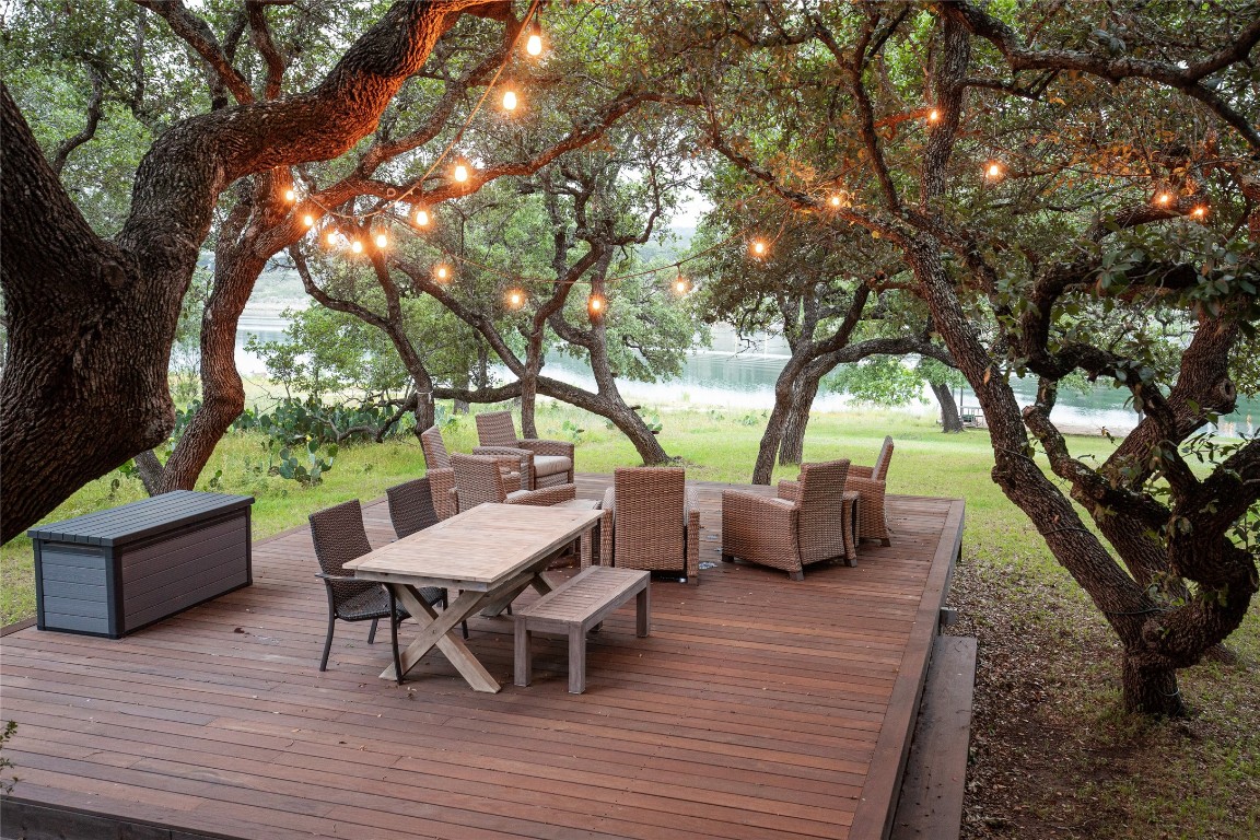 an outdoor space with furniture and wooden floor