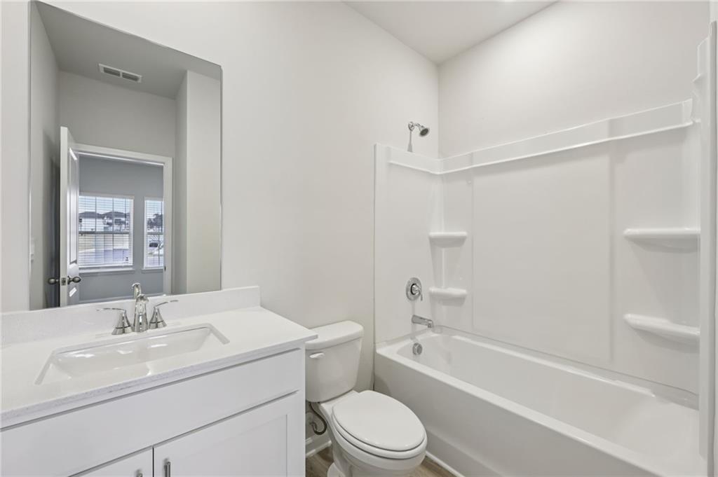 471 Tallulah Lane Grayson, GA 30017 - Photo 15 of 38 a bathroom with a sink toilet and shower