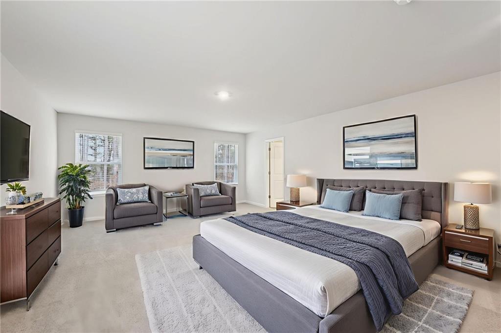 471 Tallulah Lane Grayson, GA 30017 - Photo 23 of 38 a bedroom with furniture and a flat screen tv