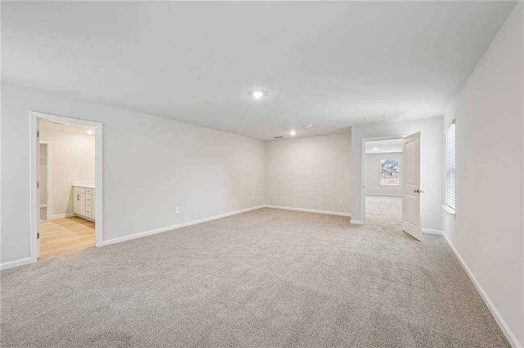 471 Tallulah Lane Grayson, GA 30017 - Photo 24 of 38 a view of an empty room with a gallery