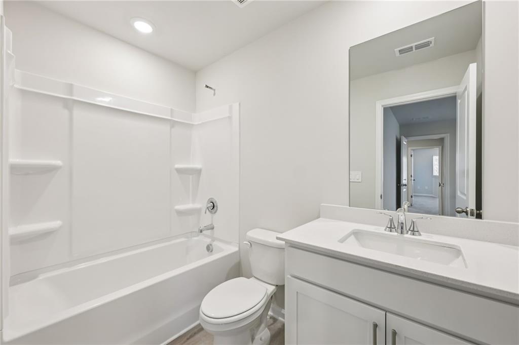 471 Tallulah Lane Grayson, GA 30017 - Photo 30 of 38 a bathroom with a sink toilet and a bathtub