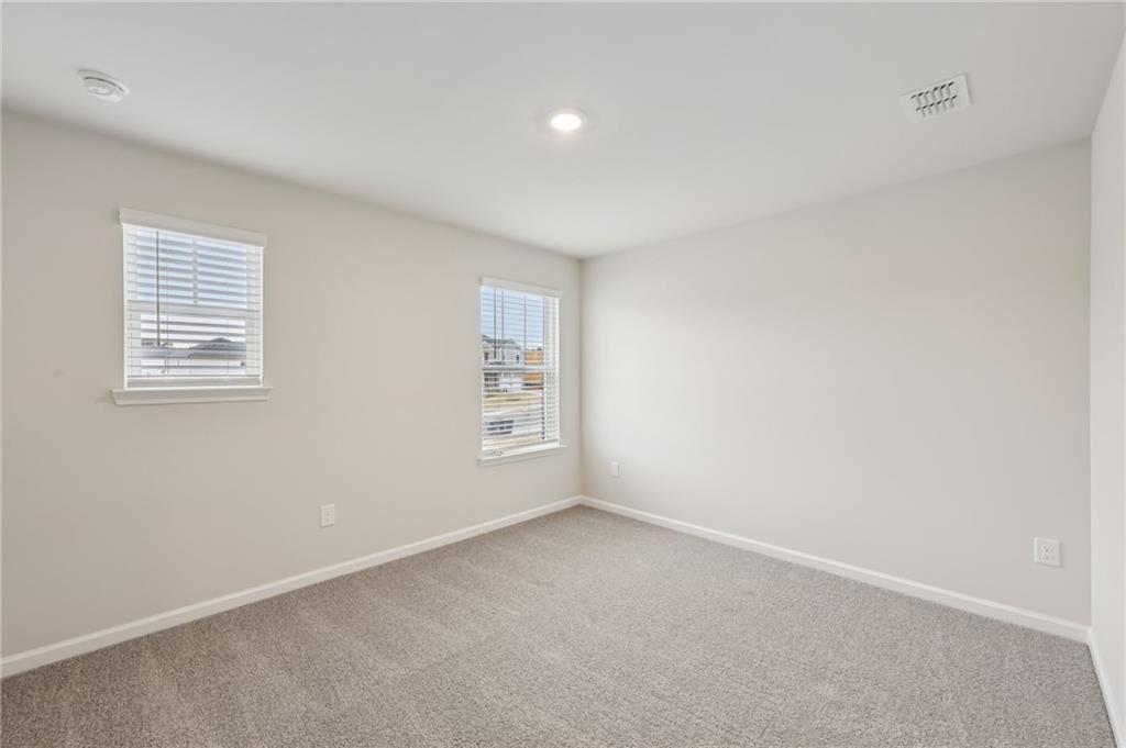 471 Tallulah Lane Grayson, GA 30017 - Photo 35 of 38 an empty room with windows