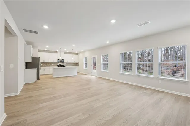 a view of kitchen with wooden floor
