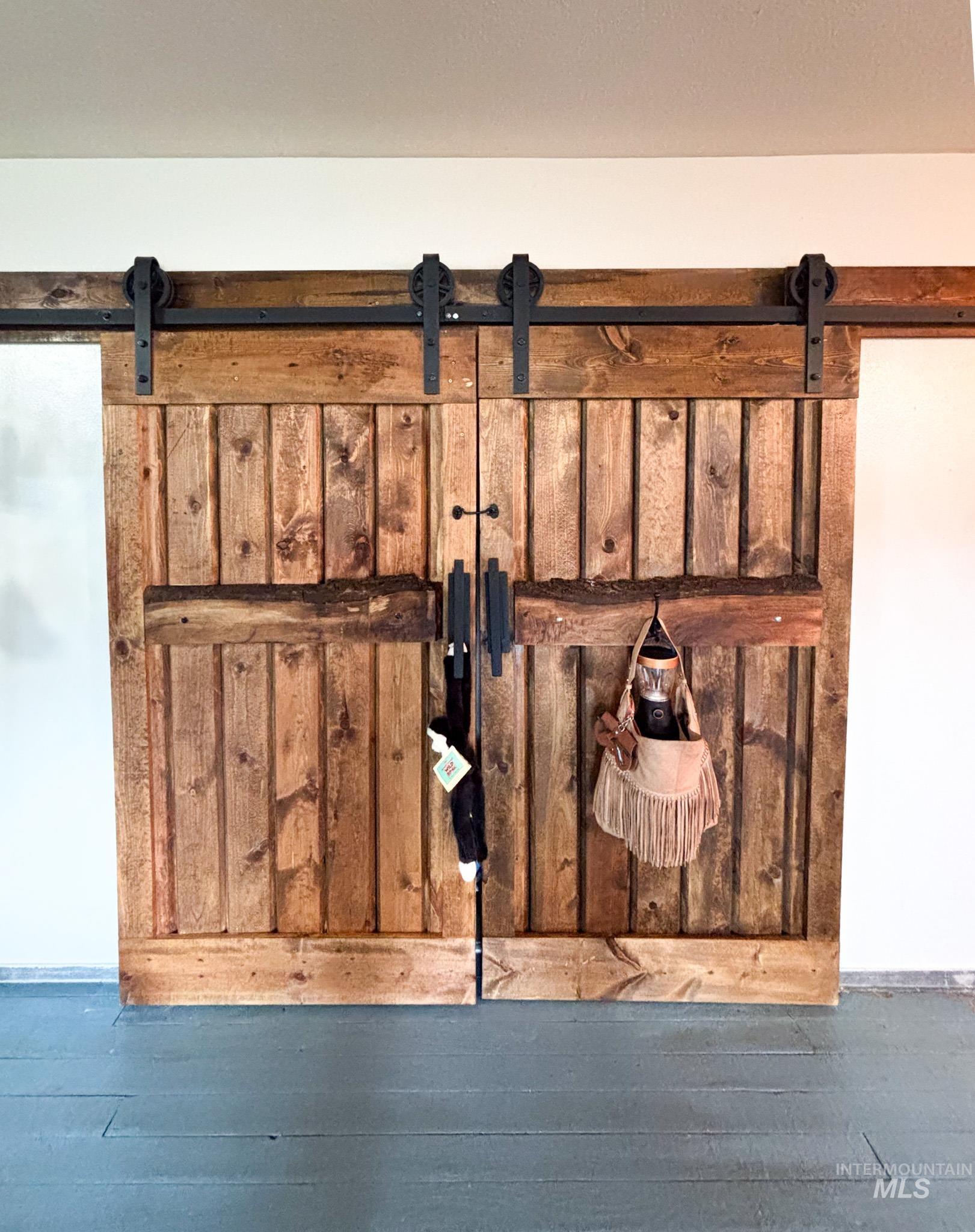 1995 Glenwood Road Kamiah, ID 83536 - Photo 24 of 38 Natural wood barn doors with dark bronze hardware