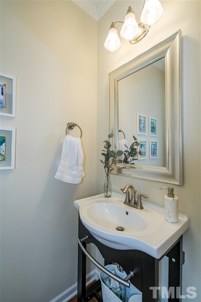 1547 Crafton Way Raleigh, NC 27607 - Photo 15 of 27 a bathroom with a sink and a mirror