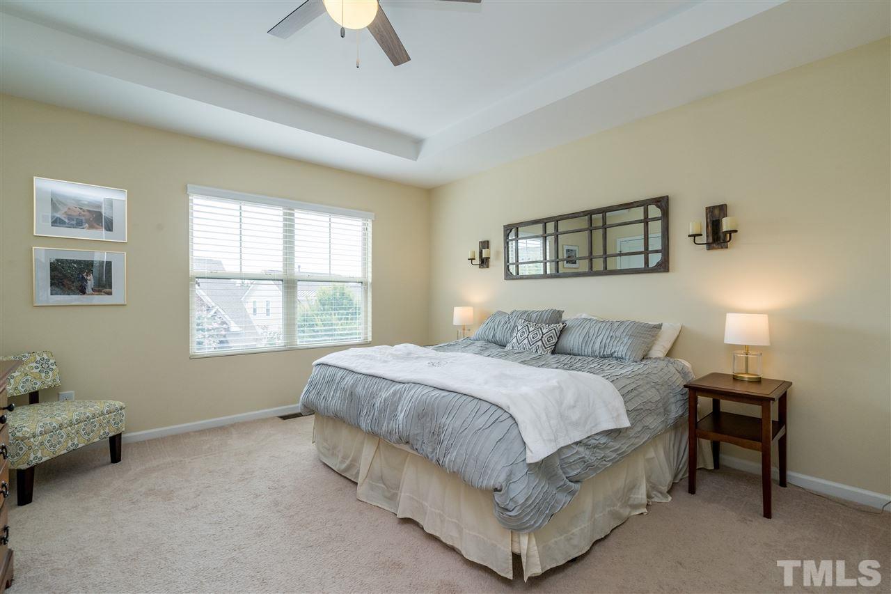 1547 Crafton Way Raleigh, NC 27607 - Photo 17 of 27 a bedroom with a bed and a window