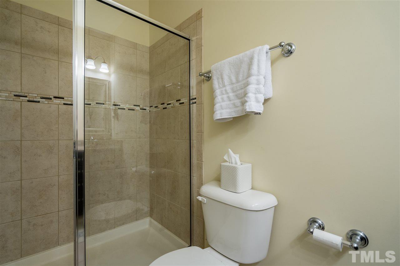 1547 Crafton Way Raleigh, NC 27607 - Photo 20 of 27 a bathroom with a shower and toilet