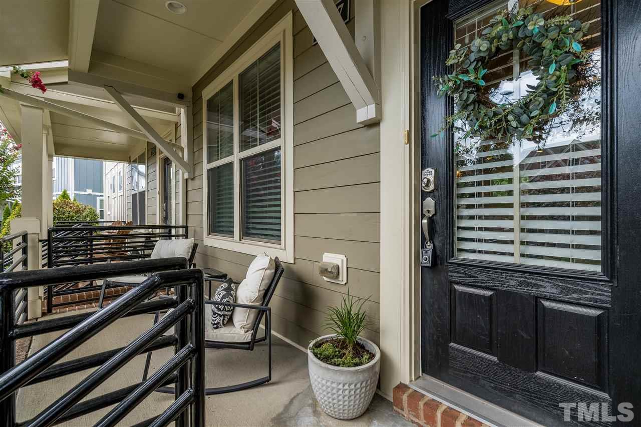 1547 Crafton Way Raleigh, NC 27607 - Photo 3 of 27 a balcony with chairs and a potted plant