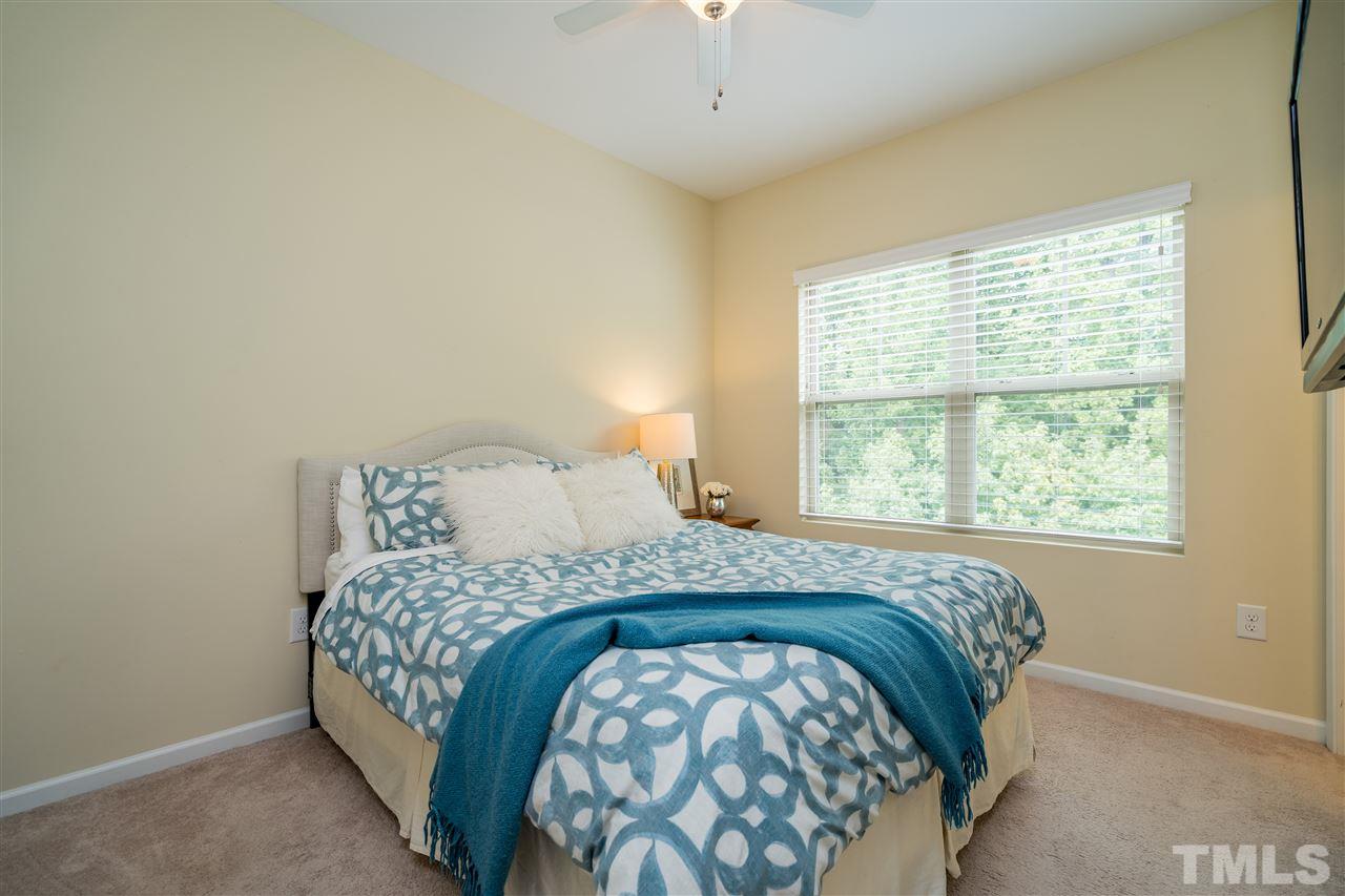 1547 Crafton Way Raleigh, NC 27607 - Photo 21 of 27 a bedroom with a bed and a window