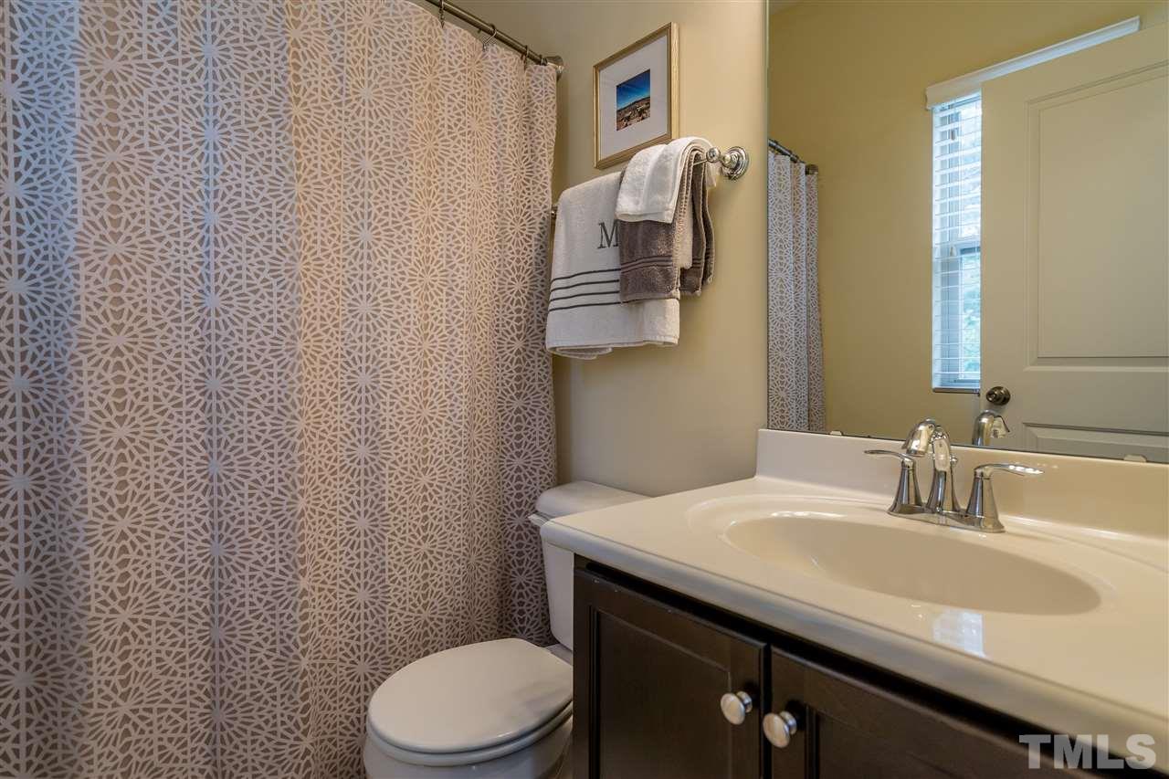 1547 Crafton Way Raleigh, NC 27607 - Photo 22 of 27 a bathroom with a sink toilet and mirror