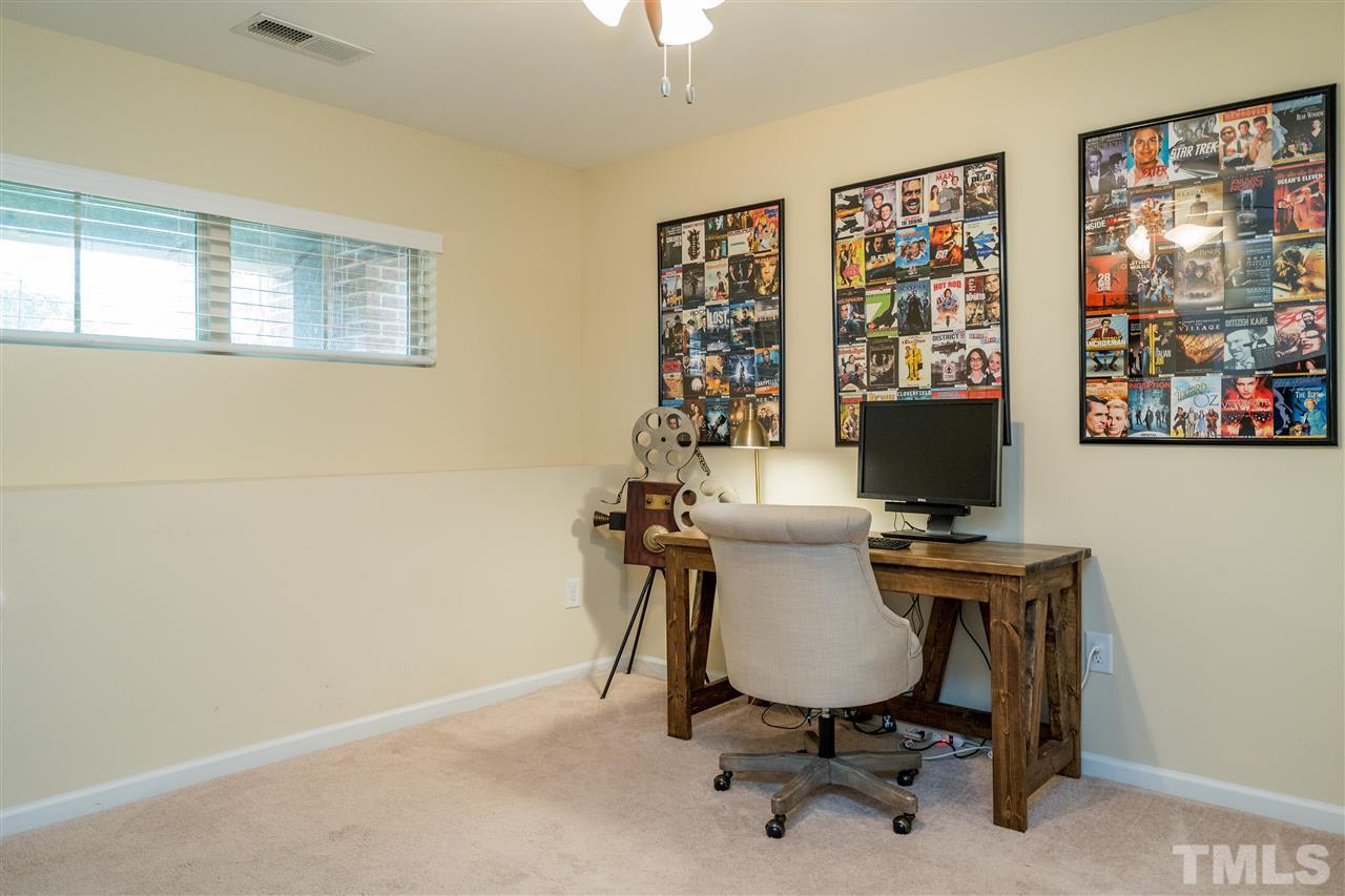 1547 Crafton Way Raleigh, NC 27607 - Photo 23 of 27 a view of a workspace with furniture and a window