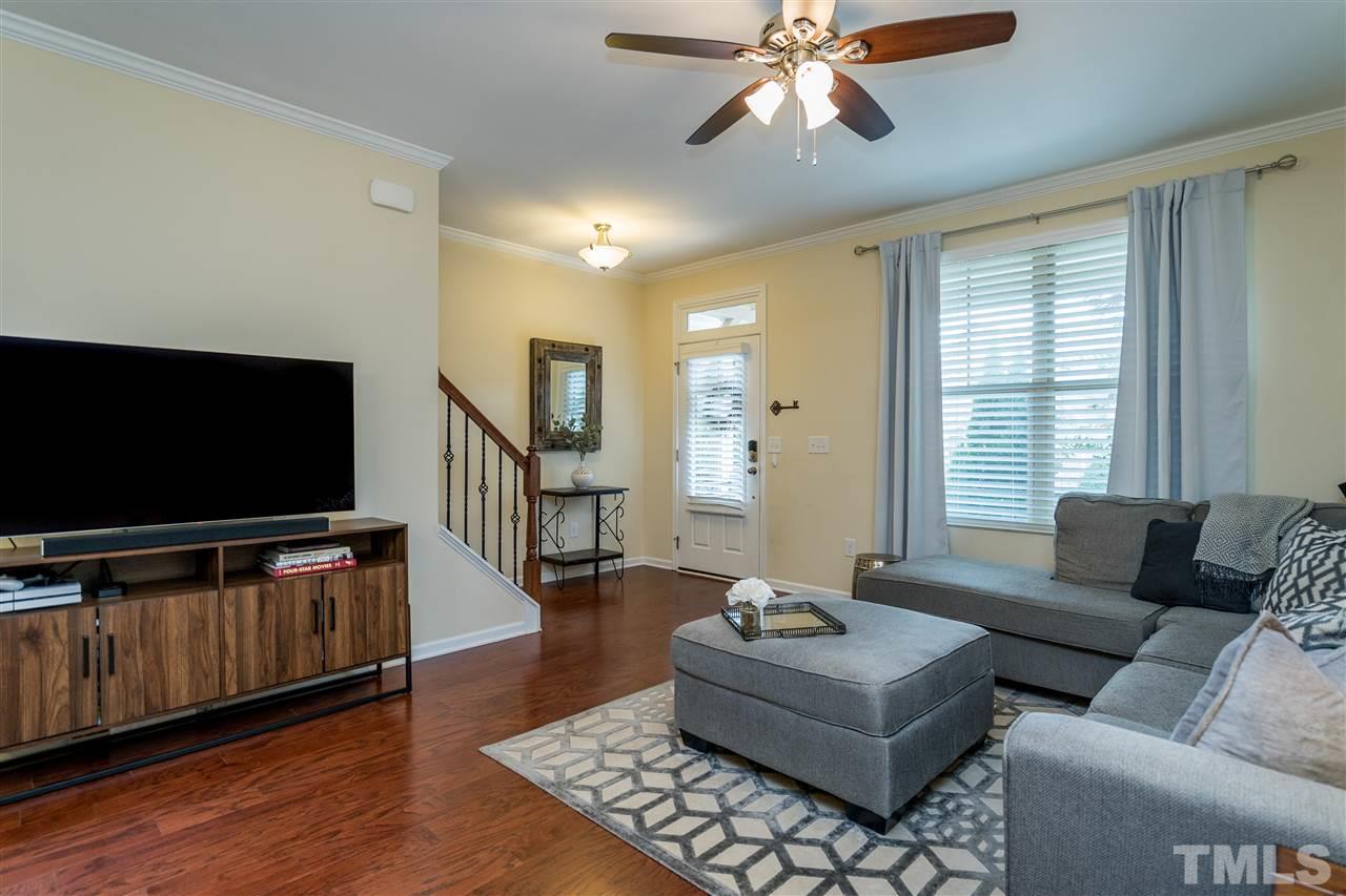 1547 Crafton Way Raleigh, NC 27607 - Photo 5 of 27 a living room with furniture and a flat screen tv