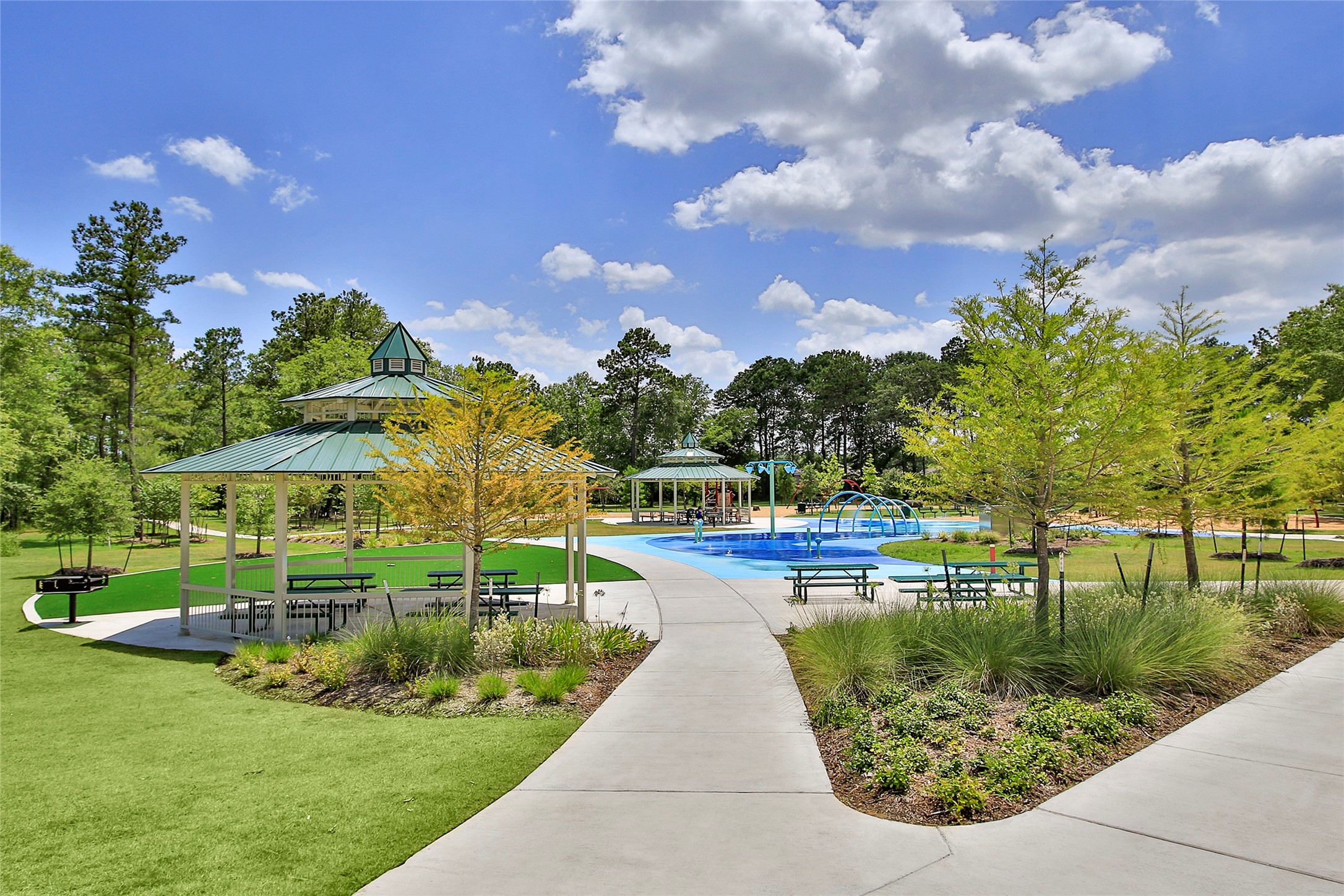 10402 Red Cardinal Drive Cleveland, TX 77328 - Photo 20 of 24 a view of a lake with a house in the background