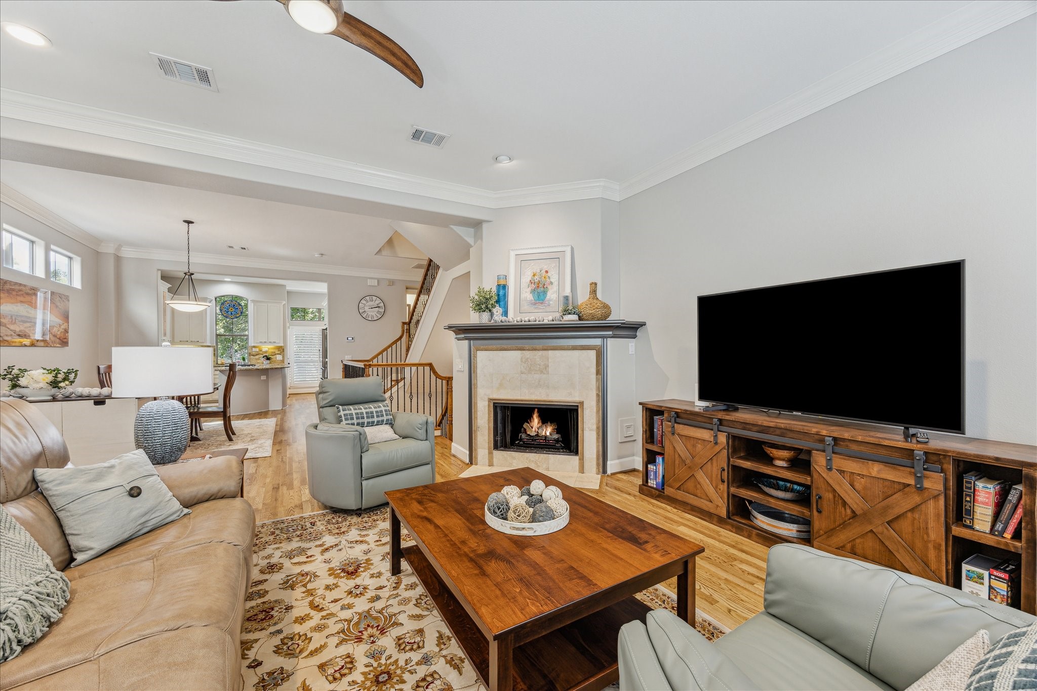 544 Bomar Street Houston, TX 77006 - Photo 18 of 43 FAMILY ROOM... Upstairs, the open-concept family room with a cozy fireplace seamlessly connects to the formal dining area and breakfast room.