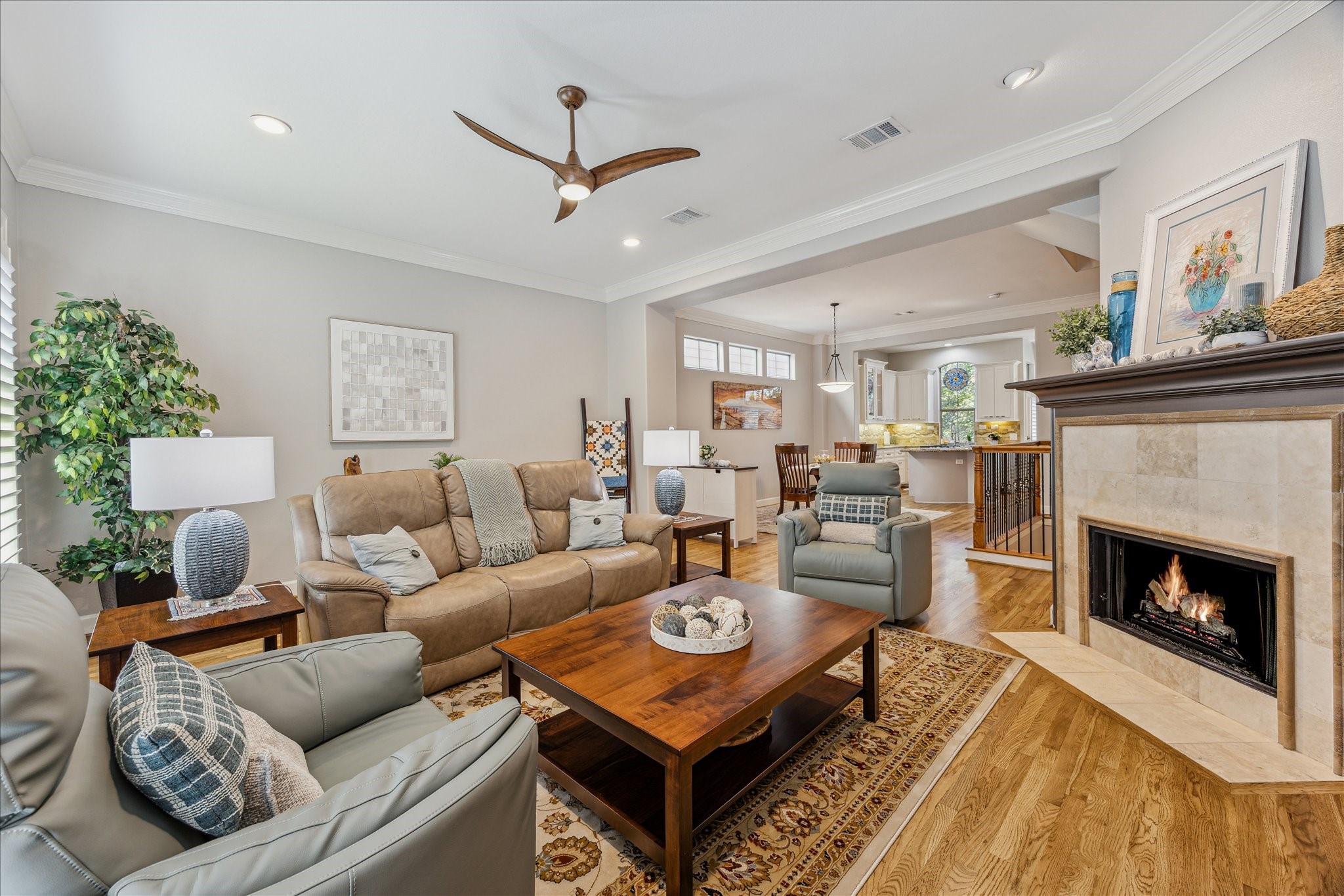 544 Bomar Street Houston, TX 77006 - Photo 21 of 43 FAMILY ROOM... This view captures the seamless connection between the family room, formal dining area, and open-concept layout. The thoughtful design enhances the flow of natural light and creates an inviting space ideal for both everyday living and entertaining.