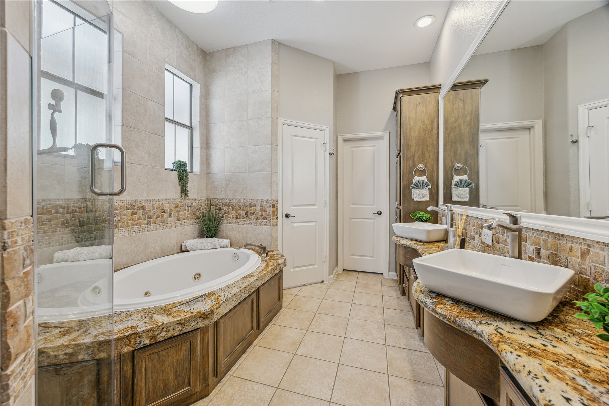 544 Bomar Street Houston, TX 77006 - Photo 6 of 43 PRIMARY BATH... A spa-inspired bath with a Jacuzzi tub, walk-in shower, and elegant finishes.