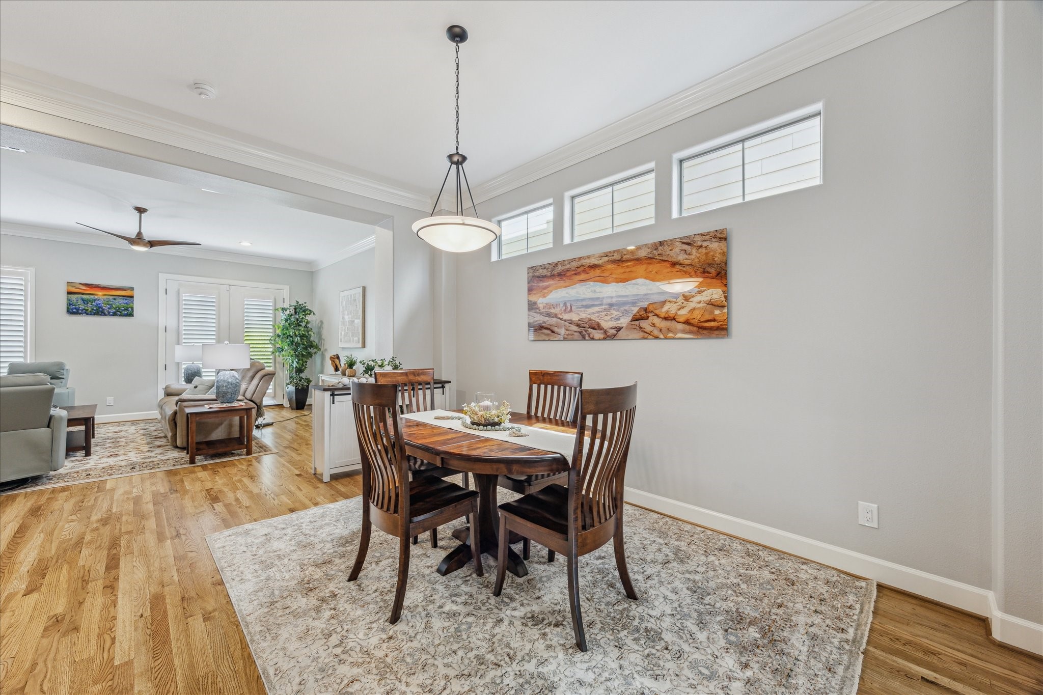 544 Bomar Street Houston, TX 77006 - Photo 7 of 43 FORMAL DINING... Situated on the second floor, this elegant dining space features classic crown molding, transom windows that invite natural light, and fresh neutral paint that enhances its timeless appeal. A statement-making decorative chandelier adds a touch of sophistication, making it perfect for hosting memorable gatherings.