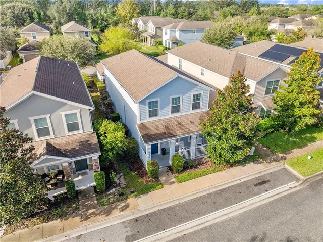 a view of a swimming pool with an outdoor seating and a yard