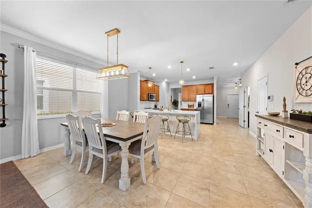 a large kitchen with stainless steel appliances lots of counter top space