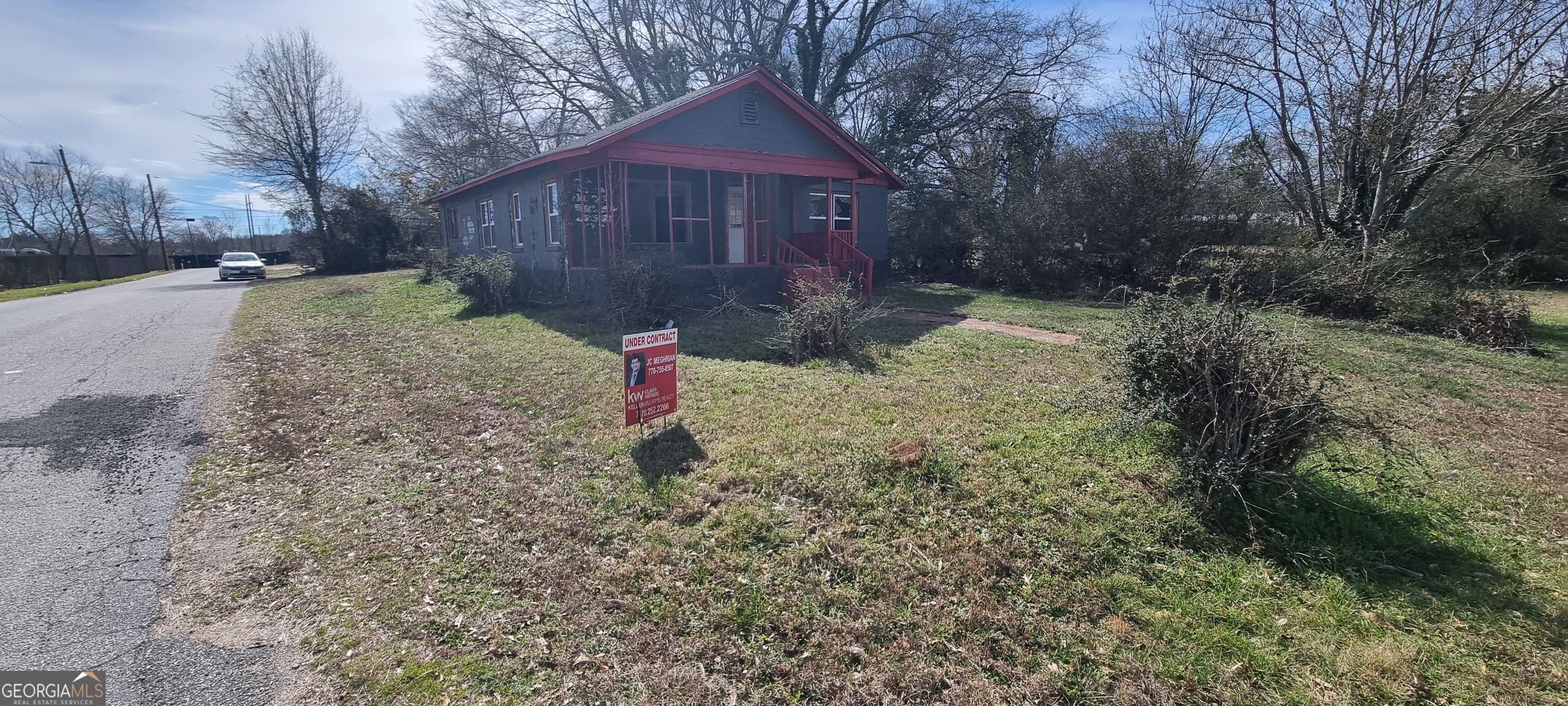 a view of a yard with trees
