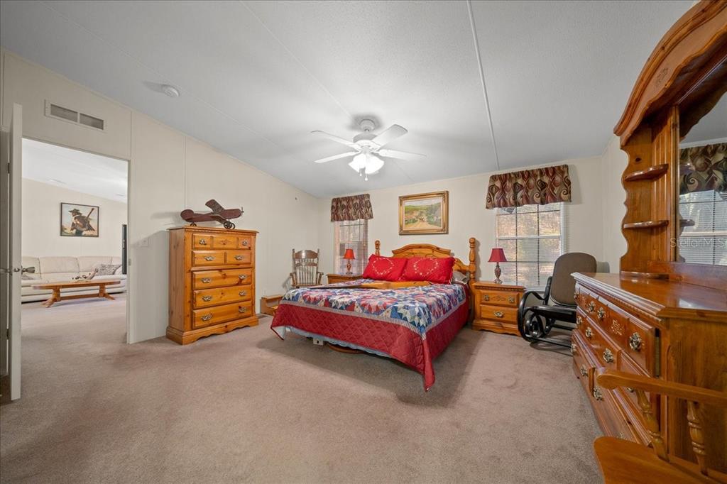 19189 Southwest 29th Street Dunnellon, FL 34432 - Photo 28 of 34 a bedroom with furniture and a bed