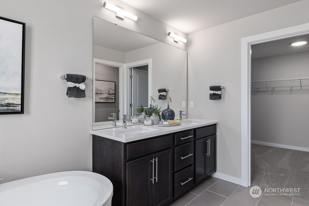 21441 Royal Anne Road Bothell, WA 98021 - Photo 21 of 29 a bathroom with a toilet a sink and mirror