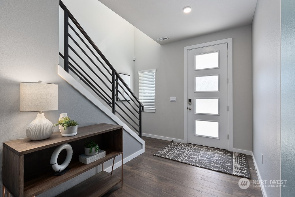 21441 Royal Anne Road Bothell, WA 98021 - Photo 3 of 29 a view of entryway and livingroom with wooden floor
