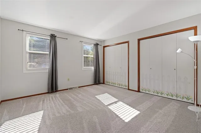 a view of empty room with windows