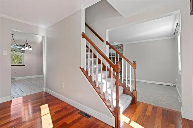 a view of an entryway with wooden floor