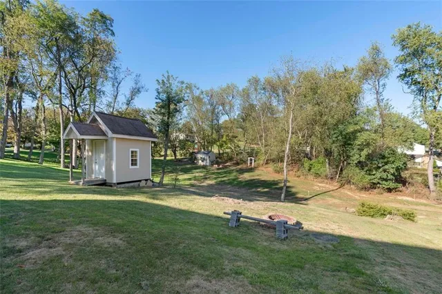 a view of a house with a wooden deck