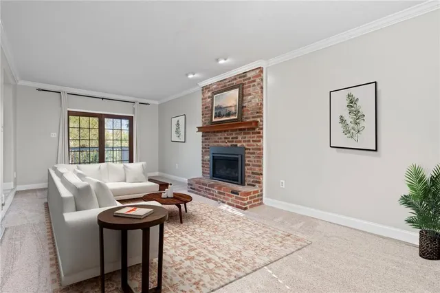 a living room with furniture a window and a fireplace