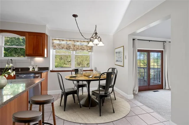 a view of a dining room with furniture and window