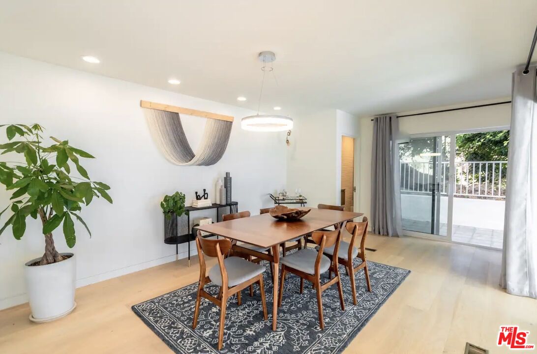 21349 Rambla Vista Malibu, CA 90265 - Photo 8 of 16 a view of a dining room with furniture and wooden floor