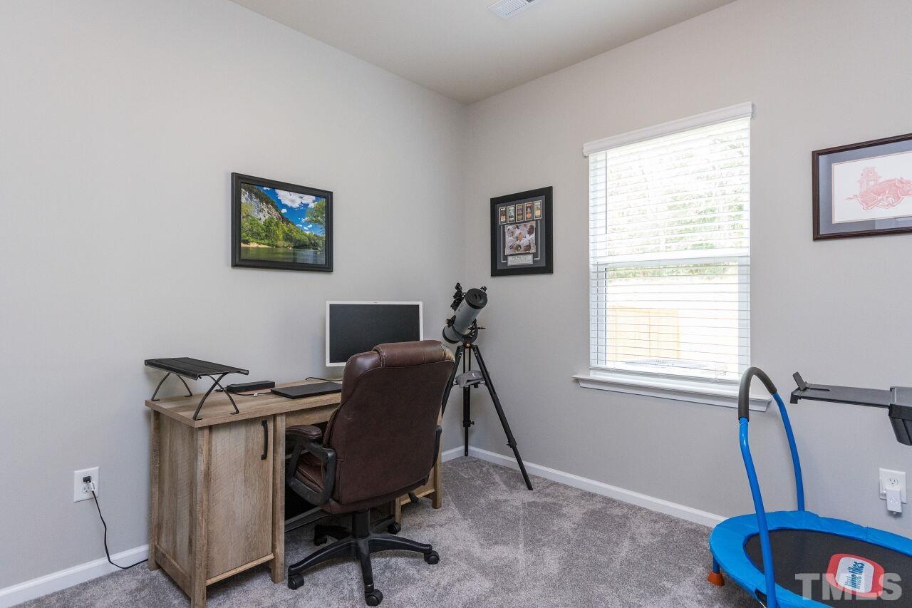 1109 Sandtrap Way Durham, NC 27703 - Photo 12 of 35 a view of a workspace with furniture and a window