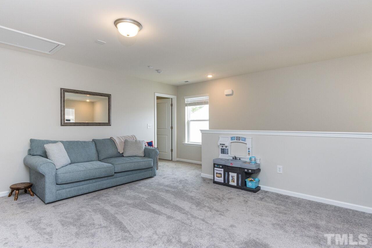1109 Sandtrap Way Durham, NC 27703 - Photo 17 of 35 a living room with furniture and a couch