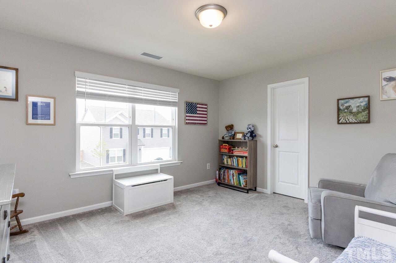 1109 Sandtrap Way Durham, NC 27703 - Photo 20 of 35 a living room with furniture and a window