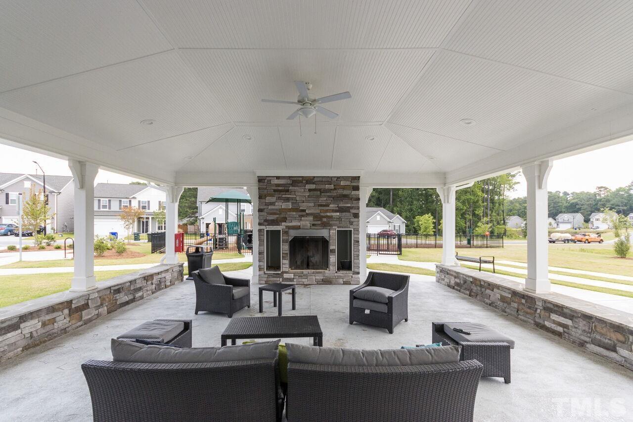 1109 Sandtrap Way Durham, NC 27703 - Photo 29 of 35 a living room with fireplace furniture and a large window