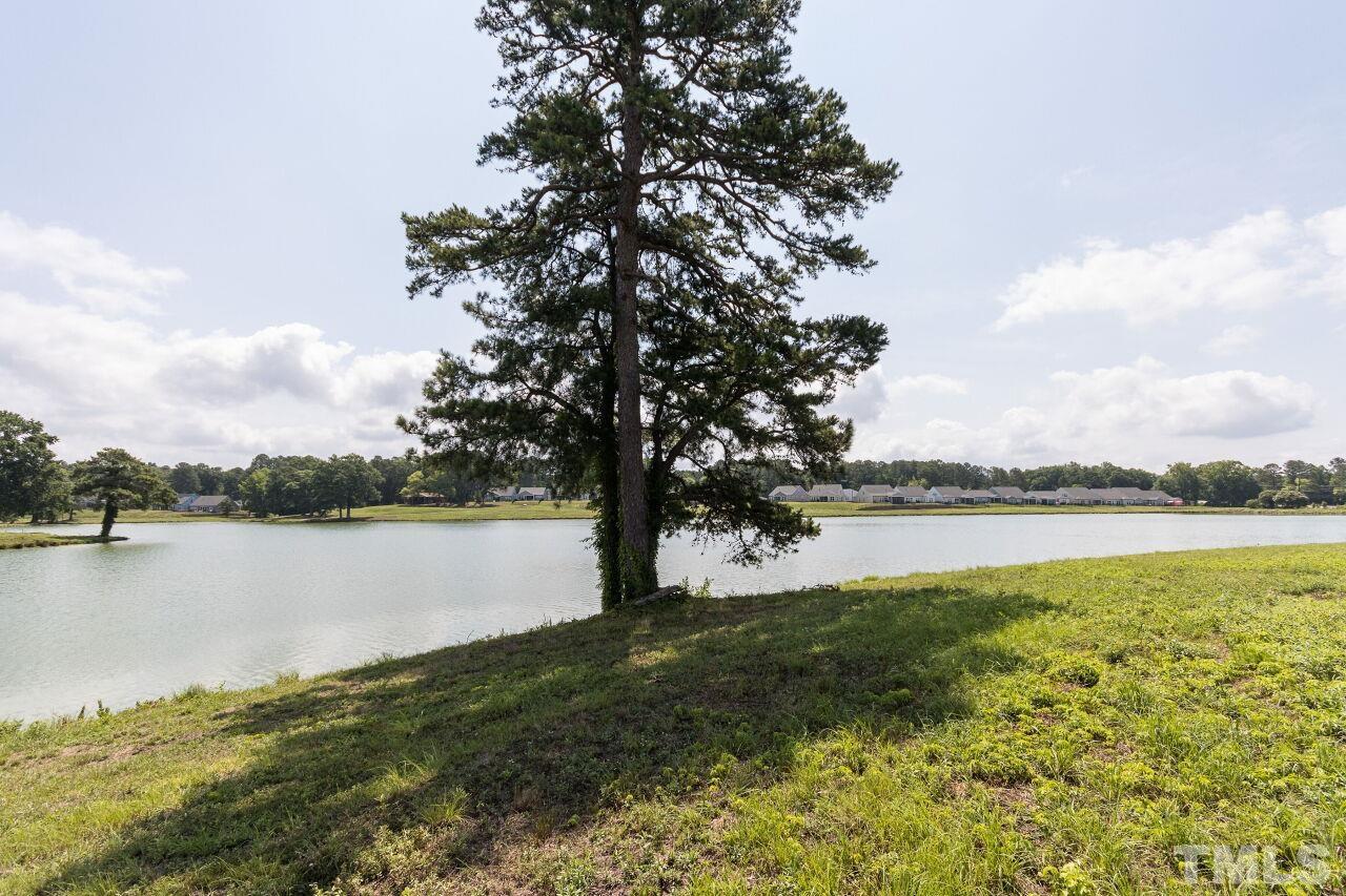 1109 Sandtrap Way Durham, NC 27703 - Photo 35 of 35 a view of a lake from a yard