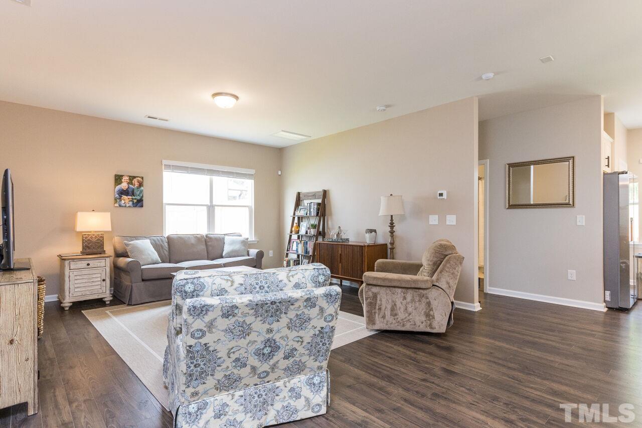 1109 Sandtrap Way Durham, NC 27703 - Photo 7 of 35 a living room with furniture and a window