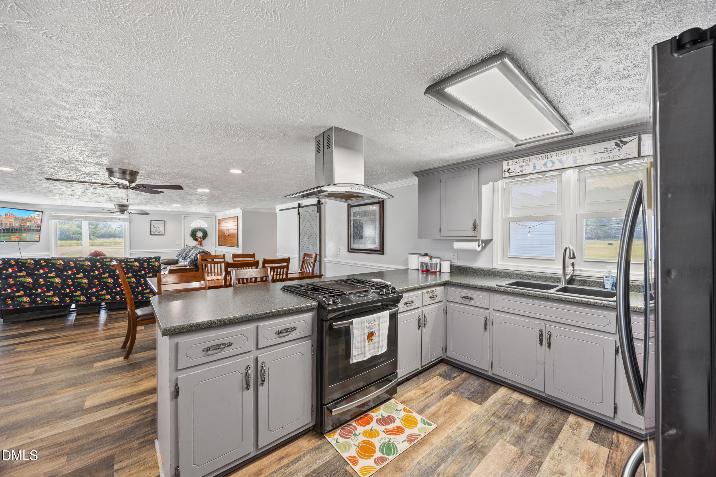 8056 Concord Church Road Autryville, NC 28318 - Photo 13 of 48 a kitchen with a sink stove and cabinets