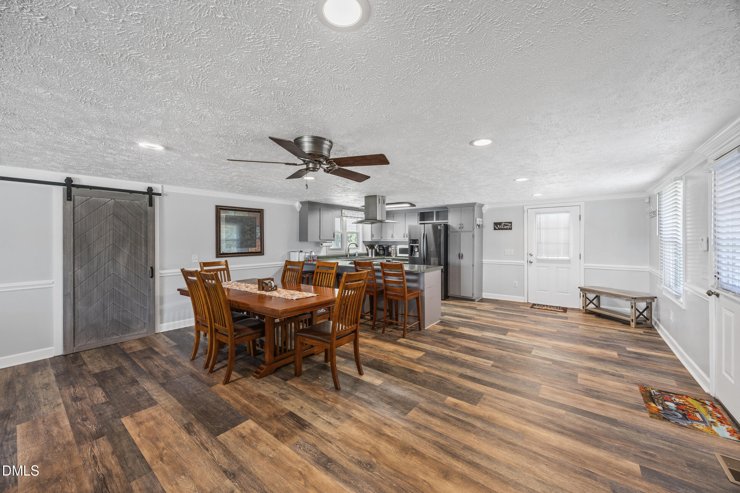 8056 Concord Church Road Autryville, NC 28318 - Photo 14 of 48 a view of a dining room with furniture and a rug