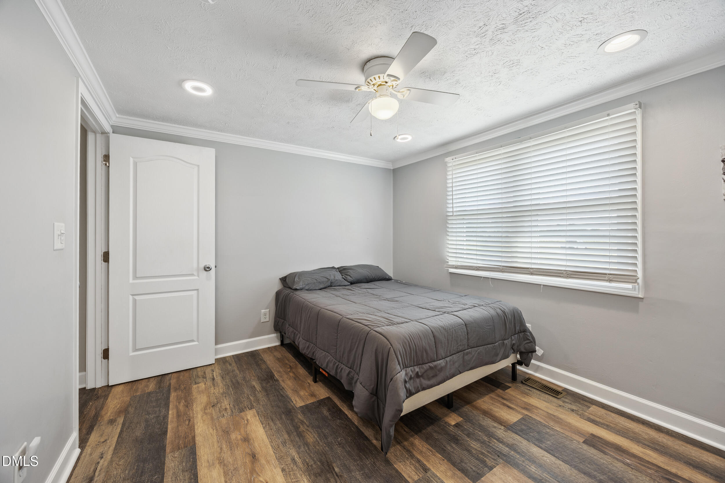 8056 Concord Church Road Autryville, NC 28318 - Photo 18 of 48 a bedroom with a bed and window
